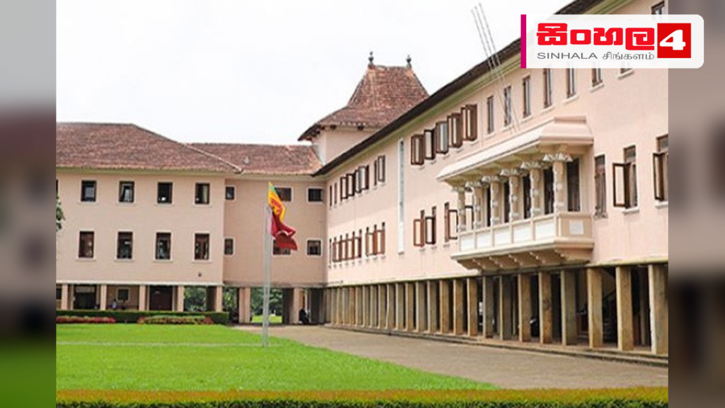 Headline: පේරාදෙණිය විශ්වවිද්‍යාලයේ පරිපාලන හා මූල්‍ය කටයුතු ගැන COPE කමිටුවේ දැඩි අවධානය Intended image subject: University of Peradeniya main entrance or administrative building