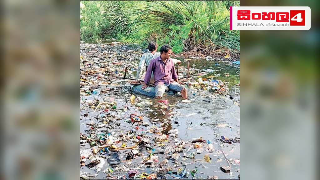 ජලයෙන් ගොඩට ආවොත් සිරුර දැවෙනවා: මාසයක් පුරා පොකුණක දිවි ගෙවන තරුණයෙක් Headline: ජලයෙන් ගොඩට ආවොත් සිරුර දැවෙනවා: මාසයක් පුරා පොකුණක දිවි ගෙවන තරුණයෙක් Intended image subject: A pond in a rural Indian village setting Story summary: ඉන්දියාවේ බටහිර බෙං