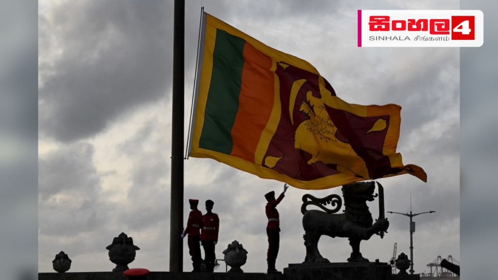 රාජ්ය ආයතනවල ජාතික කොඩිය අඩකුඹු කිරීමට උපදෙස් Headline: රාජ්ය ආයතනවල ජාතික කොඩිය අඩකුඹු කිරීමට උපදෙස් Intended image subject: Sri Lankan National Flag at half mast Story summary: ප්රවීණ සංගීතවේදිනී විශාරද නන්දා මාලනී මහත්මිය