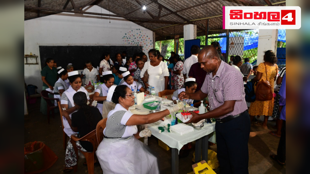සැප්තැම්බර් 1 සිට ‘ආරෝග්යා’ නව සෞඛ්ය සංකල්පය ක්රියාත්මකයි Headline: සැප්තැම්බර් 1 සිට 'ආරෝග්යා' නව සෞඛ්ය සංකල්පය ක්රියාත්මකයි Intended image subject: A modern community health center or medical consultation scene in Sri Lanka Story sum