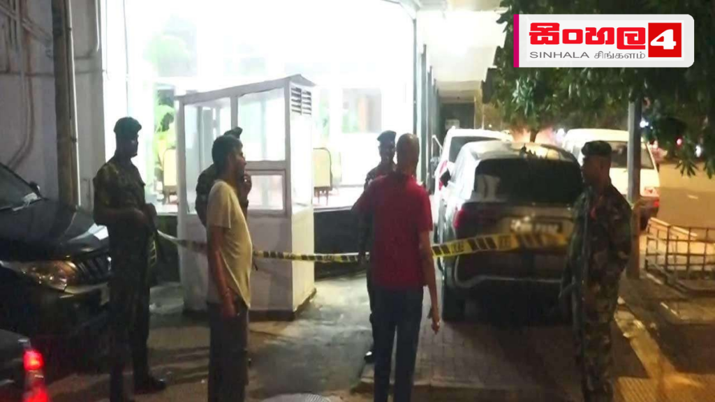 Headline: කොල්ලුපිටියේ වෙඩිතැබීමකින් දෙදෙනෙකුට තුවාල: වෙඩික්කරු අත්අඩංගුවට Intended image subject: Kollupitiya police station or general street scene in Kollupitiya Story summary: