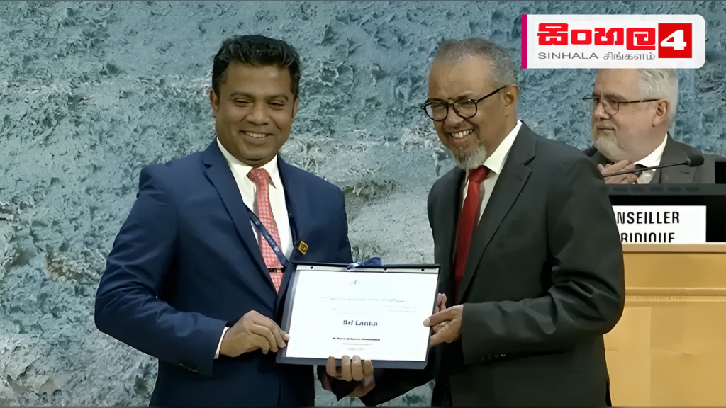 මහජන සෞඛ්ය ජයග්රහණ වෙනුවෙන් ශ්රී ලංකාවට ලෝක සෞඛ්ය සංවිධානයේ විශේෂ ඇගයීමක් Headline: මහජන සෞඛ්ය ජයග්රහණ වෙනුවෙන් ශ්රී ලංකාවට ලෝක සෞඛ්ය සංවිධානයේ විශේෂ ඇගයීමක් Intended image subject: Dr. Nalinda Jayatissa receiving the WHO award Story summary: මැලේරිය