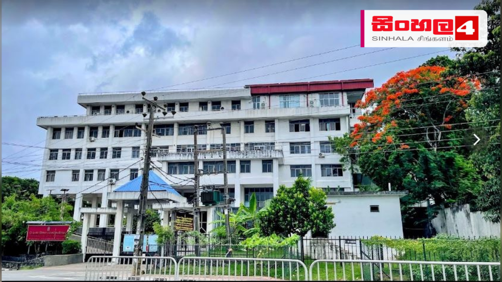 Headline: 2026 උසස් පෙළ ප්‍රායෝගික පරීක්ෂණ සඳහා ප්‍රවේශ පත්‍ර නිකුත් කෙරේ Intended image subject: Department of Examinations Sri Lanka building Story summary: 2026 අ.පො.ස. උසස් පෙළ